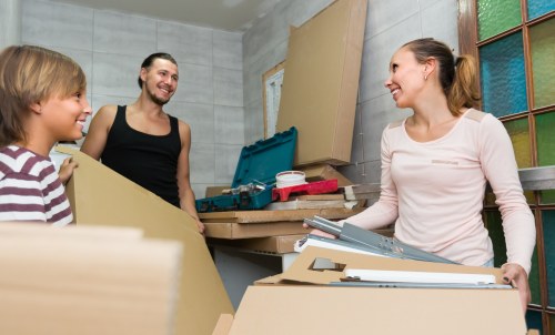 Movers preparing equipment for a safe and insured London removals service
