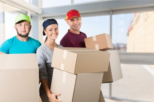 House removalists loading furniture into a moving van in London