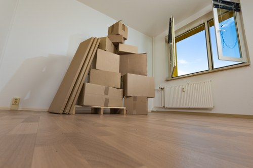 A moving team carrying boxes during a house move in London