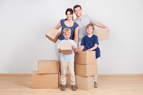 Moving team handling sofas and wardrobes during London furniture removals