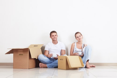 Professional movers transporting furniture during a same day move