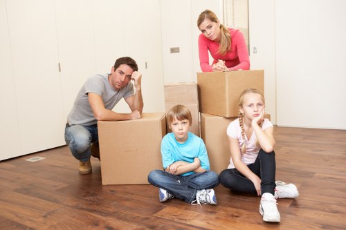Organized apartment relocation with boxes arranged for transport