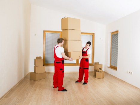 Team handling house removals in Londonmanvan with packing and loading